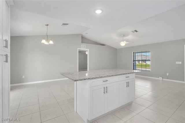 kitchen with ceiling fan with notable chandelier, light stone counters, white cabinetry, and visible vents