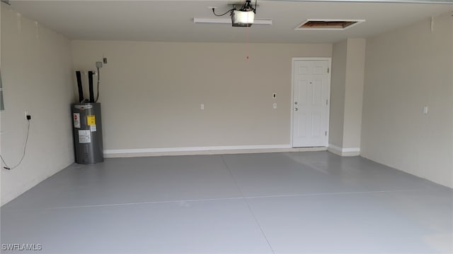 5303 4th St W, Lehigh Acres, FL 33971 - garage with electric water heater and a garage door opener