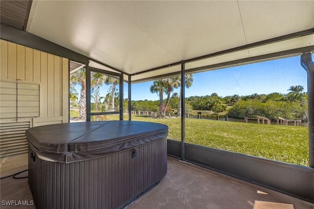 sunroom / solarium with a hot tub