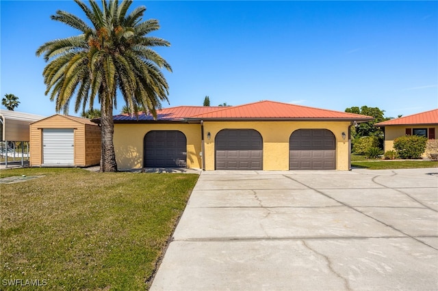 view of front facade with stucco siding, a front lawn, a garage, and driveway