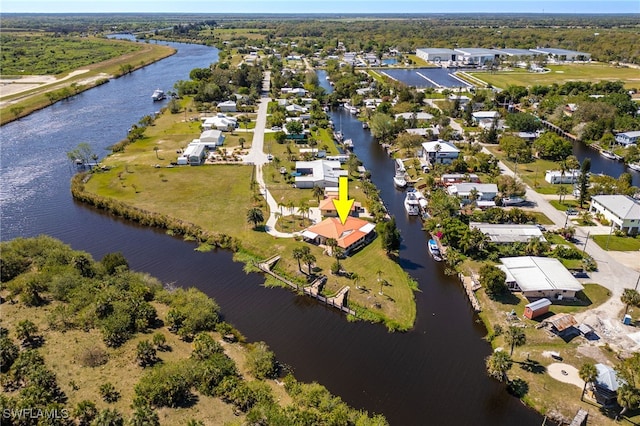 aerial view with a residential view and a water view