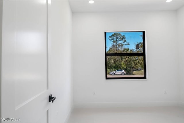 unfurnished room featuring recessed lighting