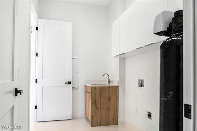 clothes washing area featuring a sink, cabinet space, hookup for an electric dryer, and hookup for a washing machine