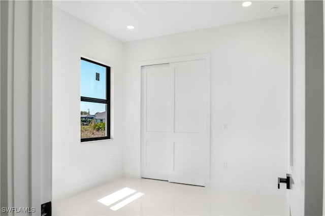 unfurnished bedroom with recessed lighting