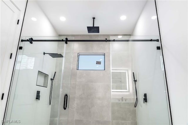 full bathroom featuring recessed lighting and a shower stall