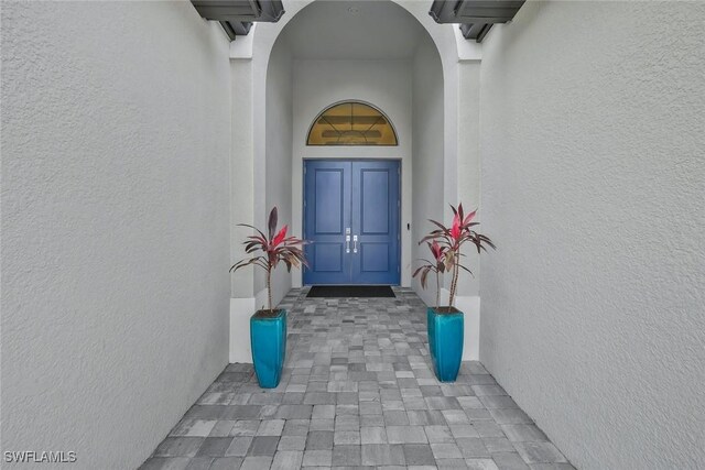 10111 Palazzo Dr, Naples, FL 34119 - view of exterior entry featuring stucco siding