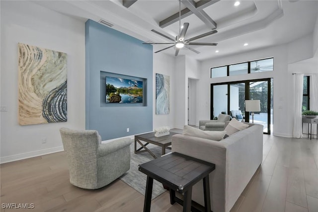 10111 Palazzo Dr, Naples, FL 34119 - living room with recessed lighting, coffered ceiling, wood finished floors, beamed ceiling, and ceiling fan