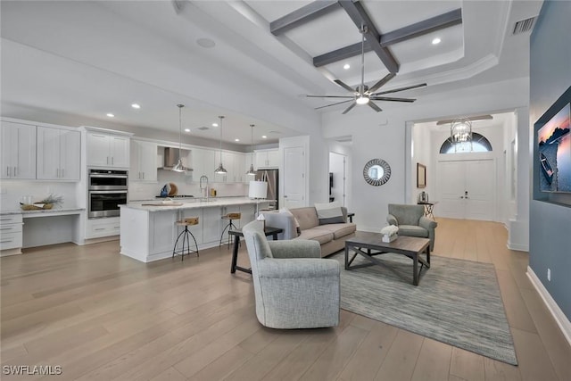 10111 Palazzo Dr, Naples, FL 34119 - living area featuring coffered ceiling, light wood finished floors, beam ceiling, a ceiling fan, and recessed lighting