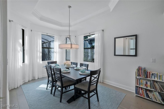 10111 Palazzo Dr, Naples, FL 34119 - dining area with ornamental molding, a raised ceiling, and baseboards