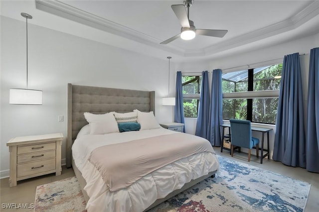 10111 Palazzo Dr, Naples, FL 34119 - bedroom with a tray ceiling, crown molding, and a ceiling fan