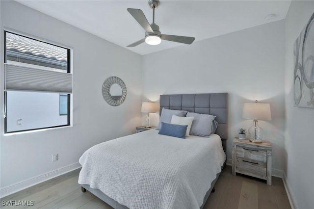 10111 Palazzo Dr, Naples, FL 34119 - bedroom featuring wood finished floors, baseboards, and a ceiling fan