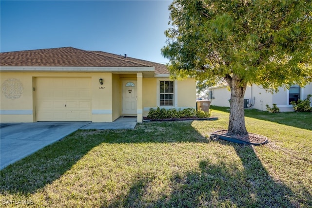 single story home featuring a front lawn, an attached garage, concrete driveway, and stucco siding