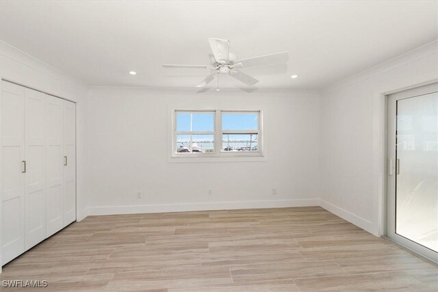 unfurnished bedroom featuring recessed lighting, light wood-type flooring, crown molding, and baseboards