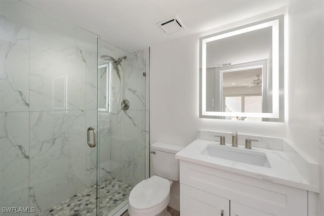 bathroom with a marble finish shower, visible vents, toilet, and vanity