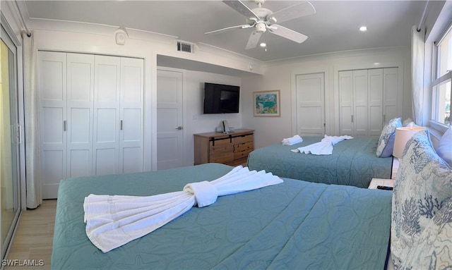 100 Estero Blvd Unit 131, Fort Myers Beach, FL 33931 - bedroom with multiple closets, light wood-style flooring, a ceiling fan, and recessed lighting
