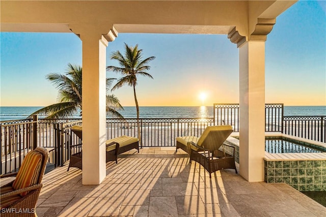 view of patio with a water view