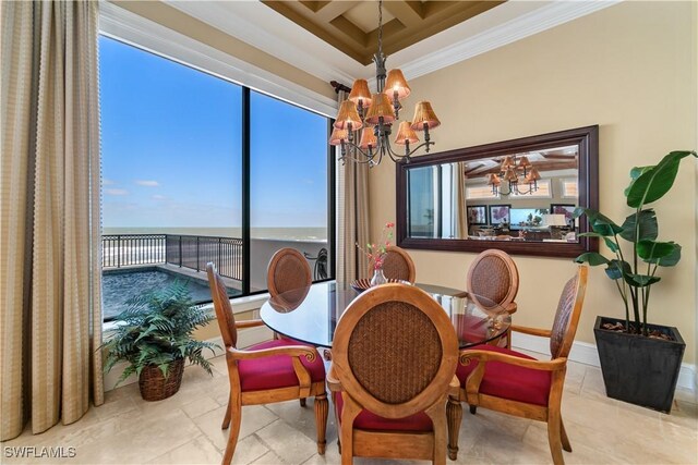 dining room with baseboards, coffered ceiling, an inviting chandelier, a water view, and crown molding