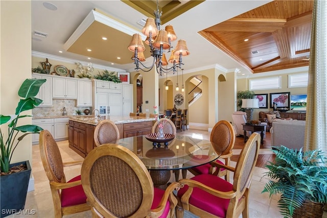 dining area with visible vents, ornamental molding, arched walkways, an inviting chandelier, and wooden ceiling