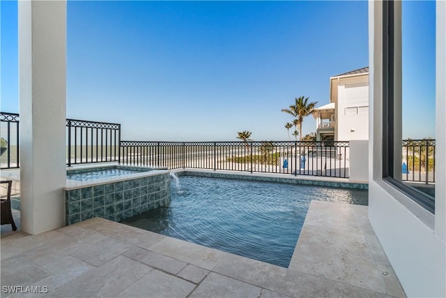 view of pool featuring an in ground hot tub and a fenced in pool