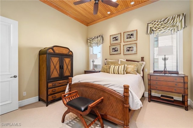 bedroom with crown molding, ceiling fan, baseboards, light carpet, and wooden ceiling