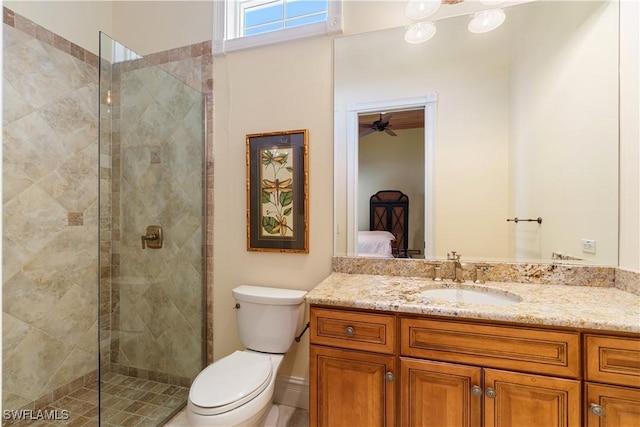 full bathroom featuring connected bathroom, toilet, and a tile shower