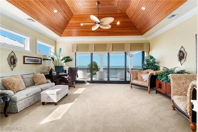 carpeted living room with wood ceiling, a raised ceiling, and ornamental molding