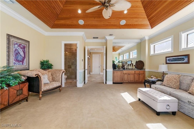 living area featuring light carpet, wooden ceiling, a tray ceiling, and ornamental molding