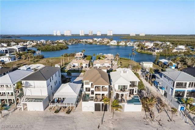 drone / aerial view with a residential view and a water view