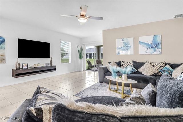 tiled living area featuring visible vents and ceiling fan