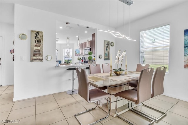 dining room featuring light tile patterned flooring