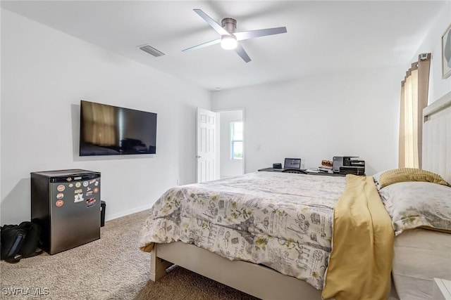 bedroom featuring visible vents, baseboards, ceiling fan, and carpet floors