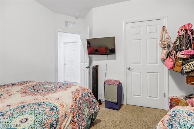 bedroom featuring visible vents and carpet