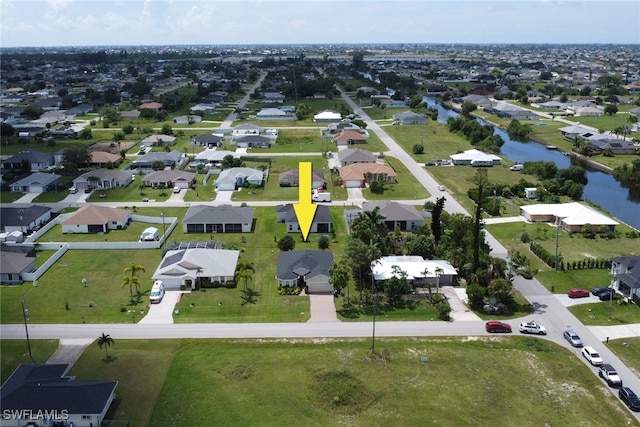 aerial view with a residential view and a water view