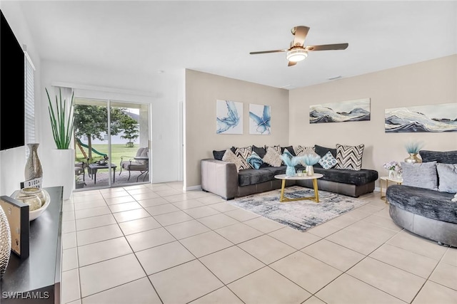 living room featuring light tile patterned floors and ceiling fan