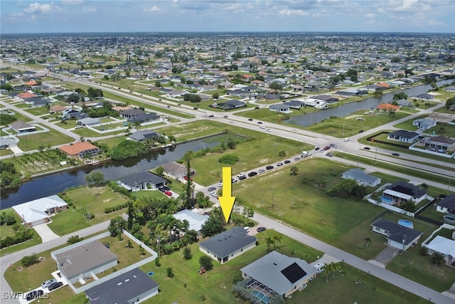 aerial view featuring a residential view and a water view