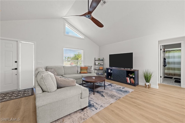 living area with wood finished floors, a ceiling fan, visible vents, and high vaulted ceiling