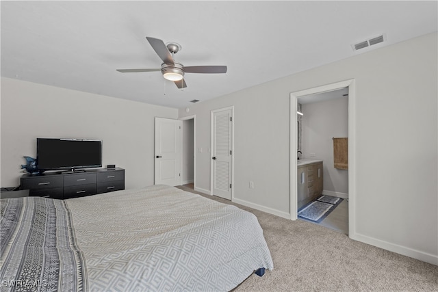 bedroom with carpet, visible vents, baseboards, ceiling fan, and connected bathroom