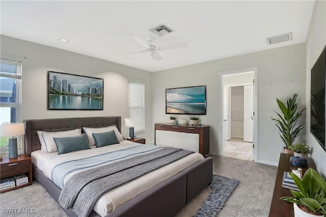 bedroom with visible vents, ceiling fan, baseboards, and carpet