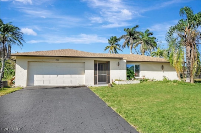 ranch-style home with a front yard, an attached garage, driveway, and stucco siding