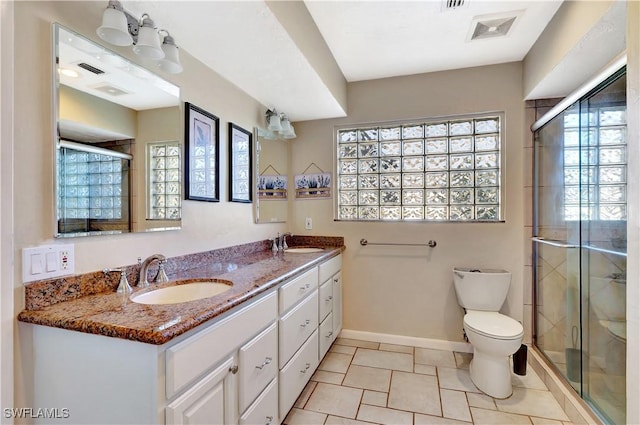 full bathroom with a shower stall, visible vents, and a sink