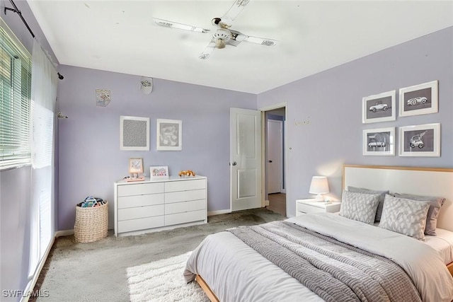 bedroom with carpet, baseboards, and ceiling fan