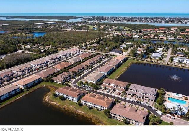 birds eye view of property featuring a residential view and a water view