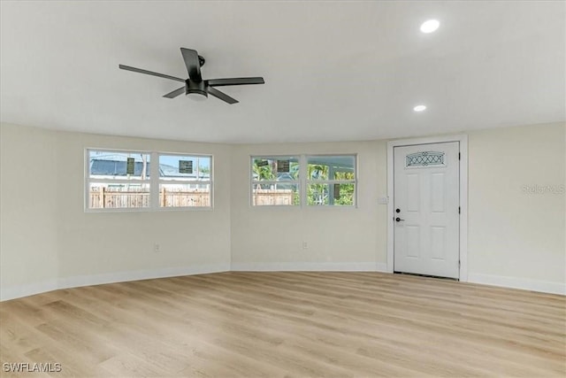 unfurnished room with recessed lighting, ceiling fan, baseboards, and light wood-style flooring