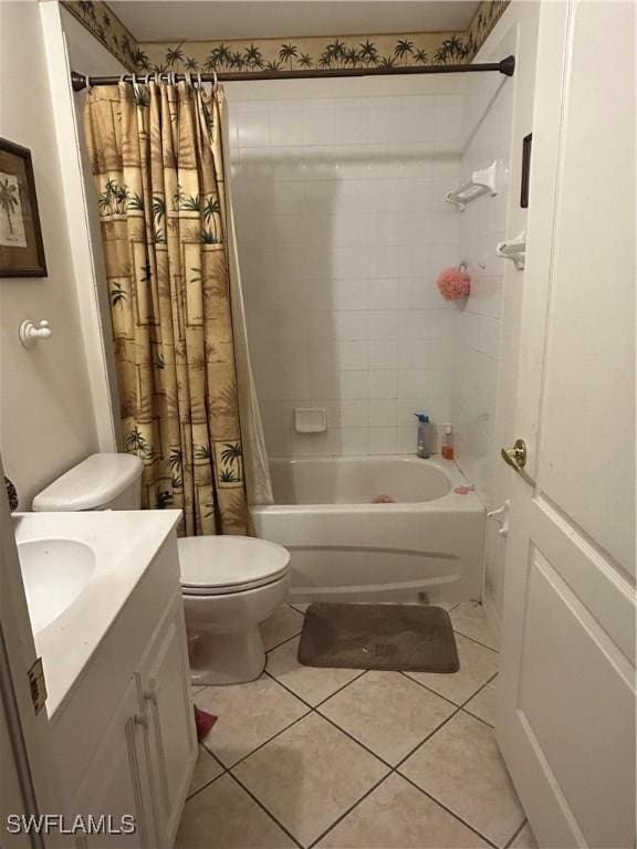 bathroom featuring tile patterned flooring, vanity, toilet, and shower / tub combo