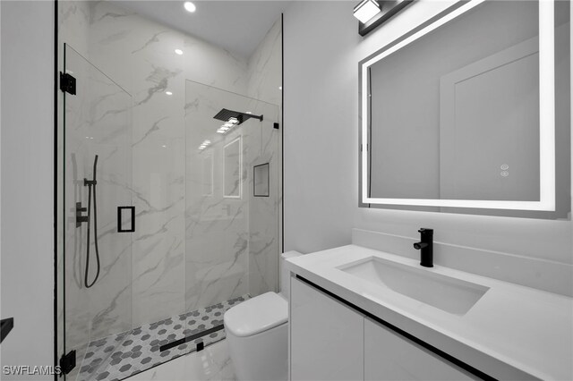 310 SW 31st Ter, Cape Coral, FL 33914 - full bathroom featuring toilet, marble finish floor, recessed lighting, a marble finish shower, and vanity