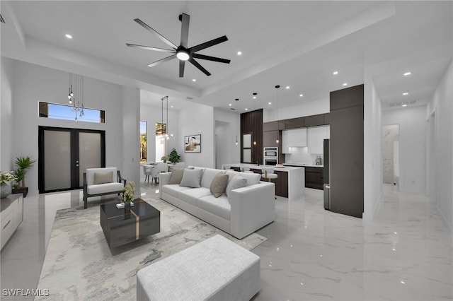 310 SW 31st Ter, Cape Coral, FL 33914 - living room featuring a high ceiling, recessed lighting, and marble finish floor