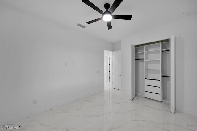 310 SW 31st Ter, Cape Coral, FL 33914 - unfurnished bedroom featuring visible vents, baseboards, marble finish floor, and ceiling fan