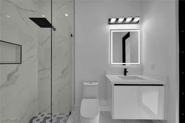 310 SW 31st Ter, Cape Coral, FL 33914 - bathroom with a marble finish shower, marble finish floor, toilet, and vanity
