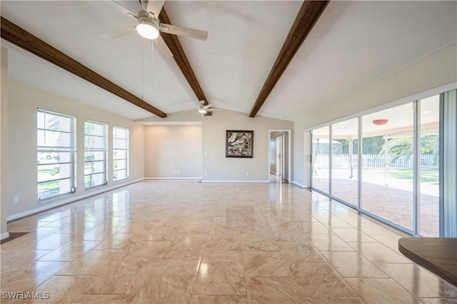 spare room with vaulted ceiling with beams, baseboards, and a ceiling fan