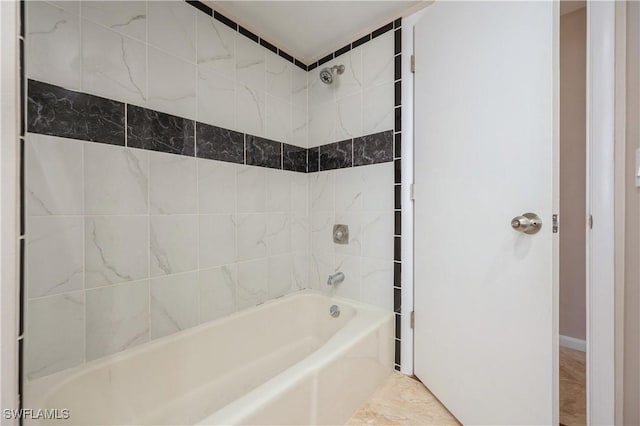 bathroom with washtub / shower combination